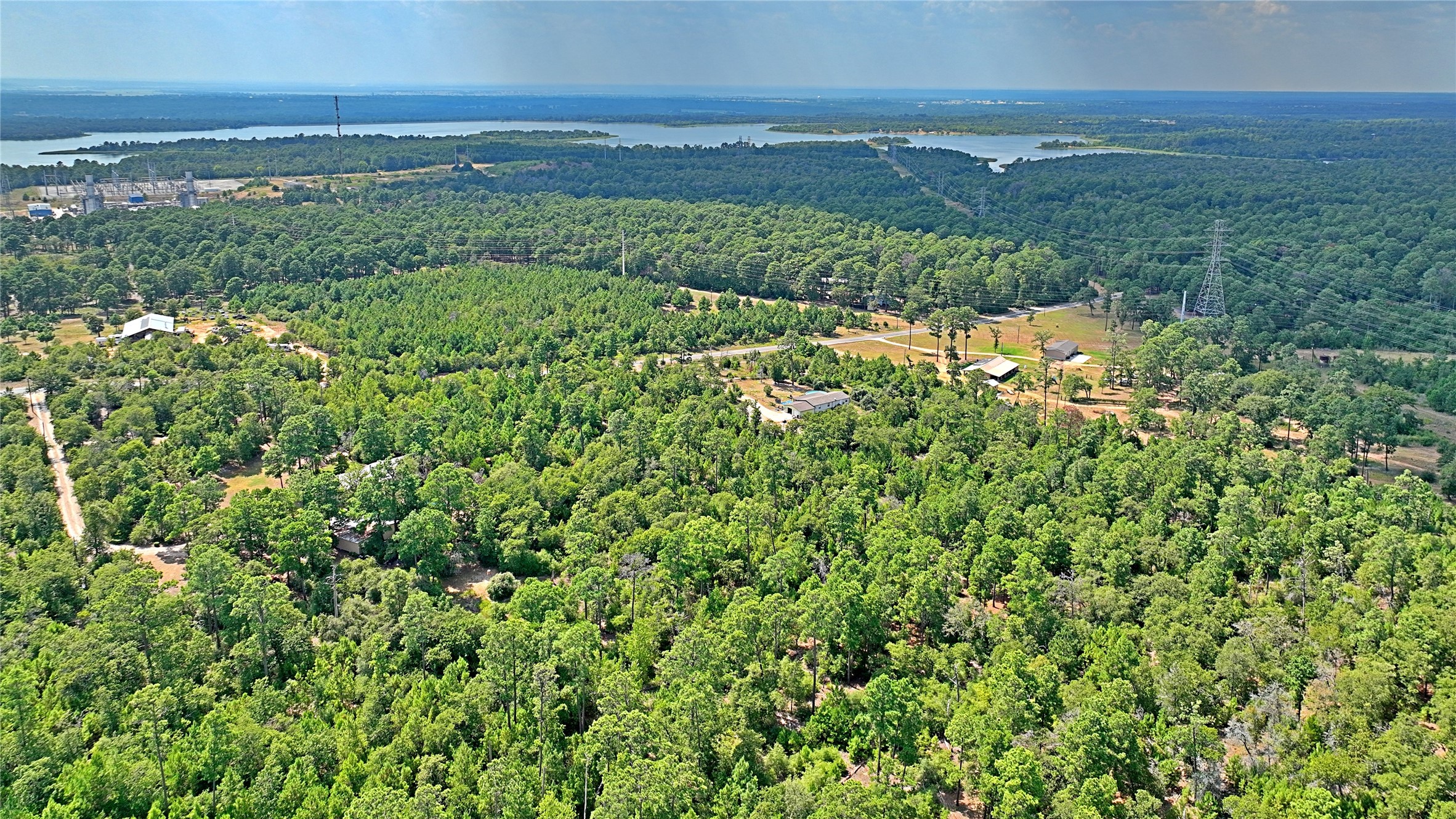 Tbd Pine Tree Loop Bastrop, TX 78602 - Photo 4 of 11 a view of a lake with a building in the background