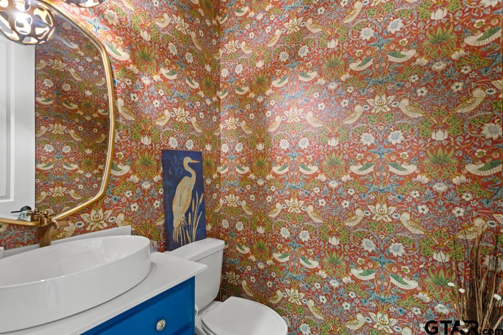 2926 Stewart Way Tyler, TX 75709 - Photo 12 of 33 a bathroom with a sink toilet and shower