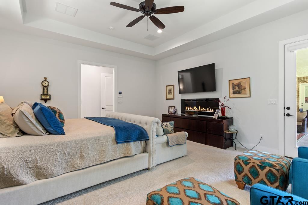 2926 Stewart Way Tyler, TX 75709 - Photo 17 of 33 a bedroom with a bed and a couch