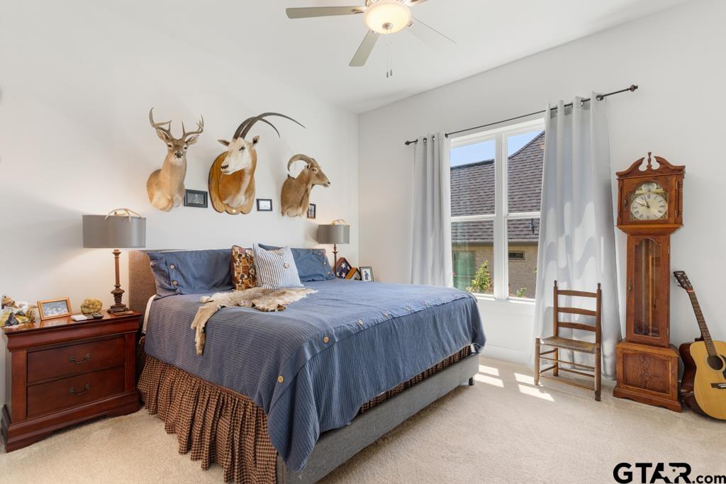 2926 Stewart Way Tyler, TX 75709 - Photo 23 of 33 a bedroom with a bed and a window