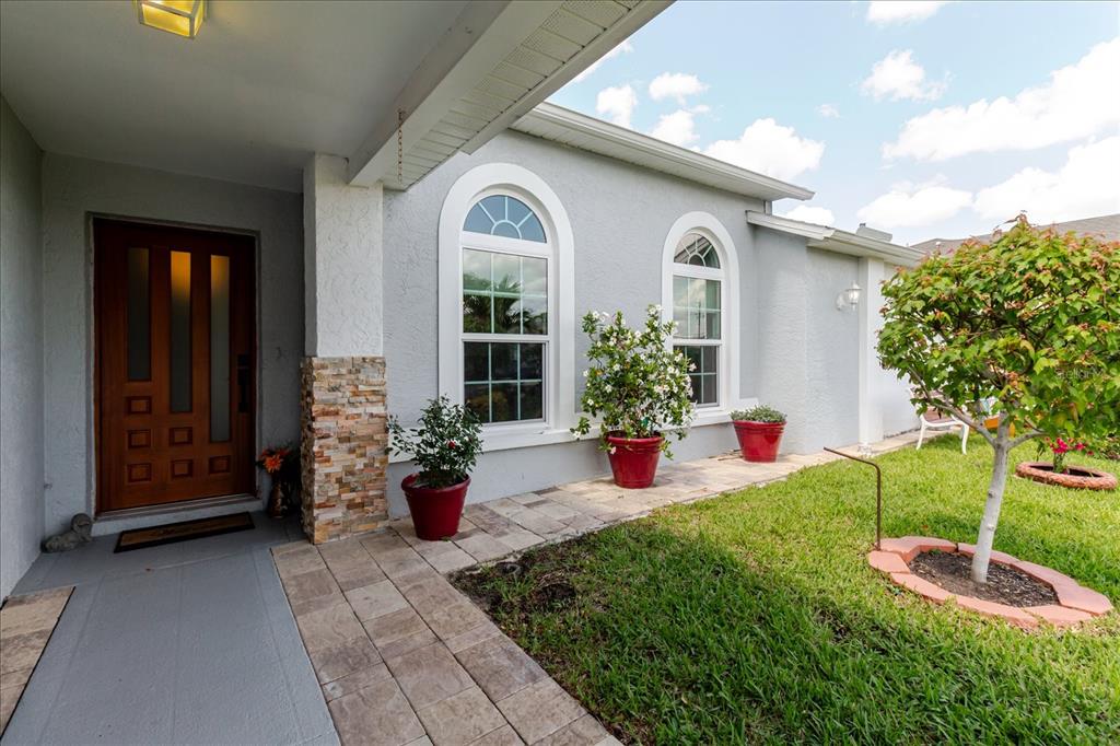 8112 Golden Bear Loop Port Richey, FL 34668 - Photo 13 of 88 a front view of a house with garden