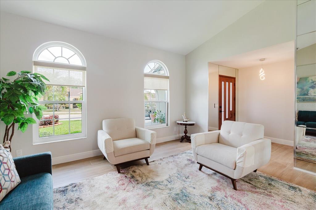 8112 Golden Bear Loop Port Richey, FL 34668 - Photo 17 of 88 a living room with furniture and a large window