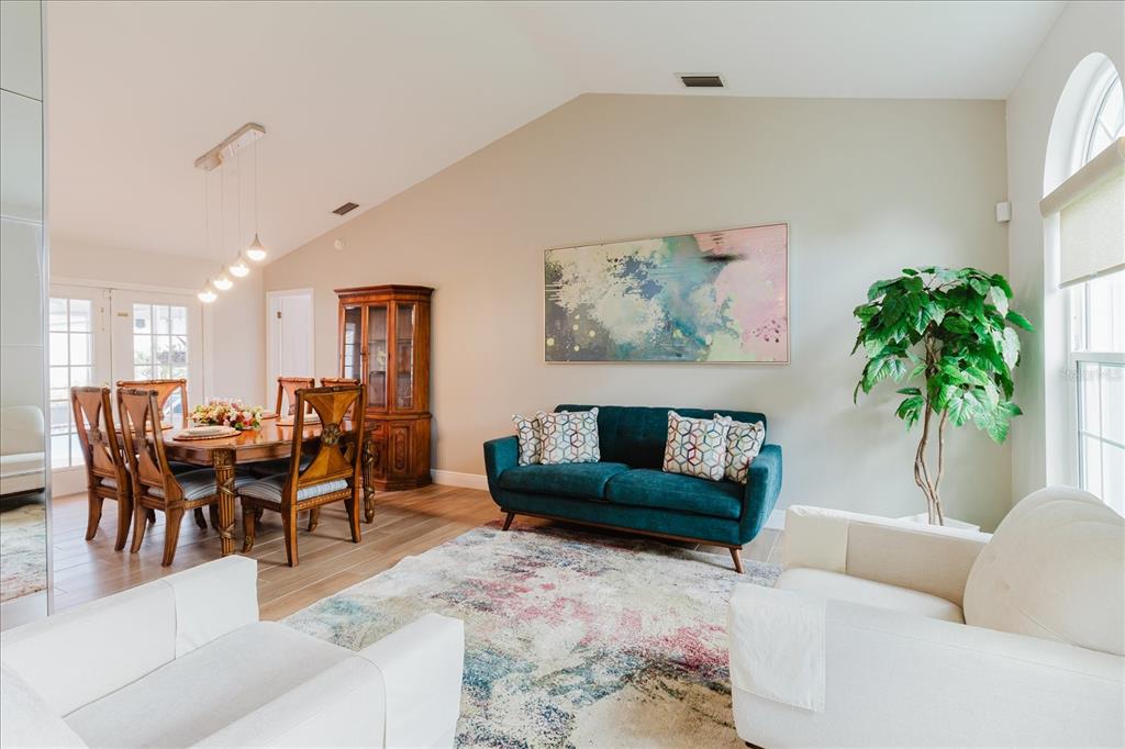 8112 Golden Bear Loop Port Richey, FL 34668 - Photo 19 of 88 a living room with furniture and a potted plant