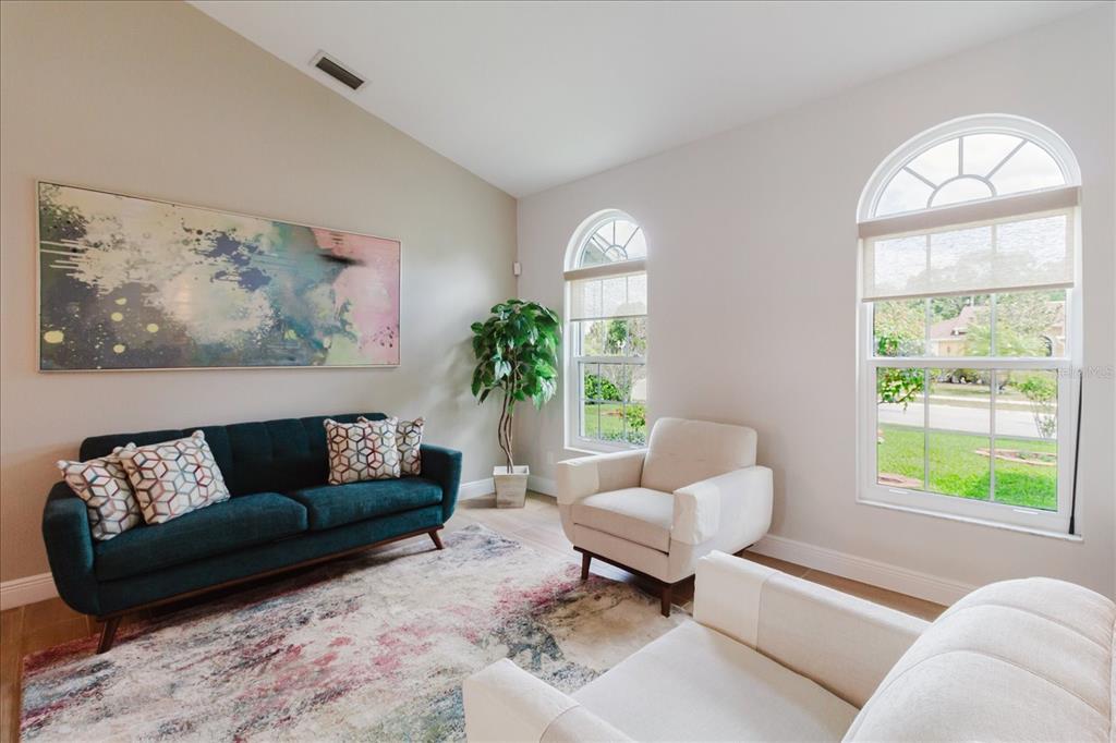 8112 Golden Bear Loop Port Richey, FL 34668 - Photo 20 of 88 a living room with furniture and a large window