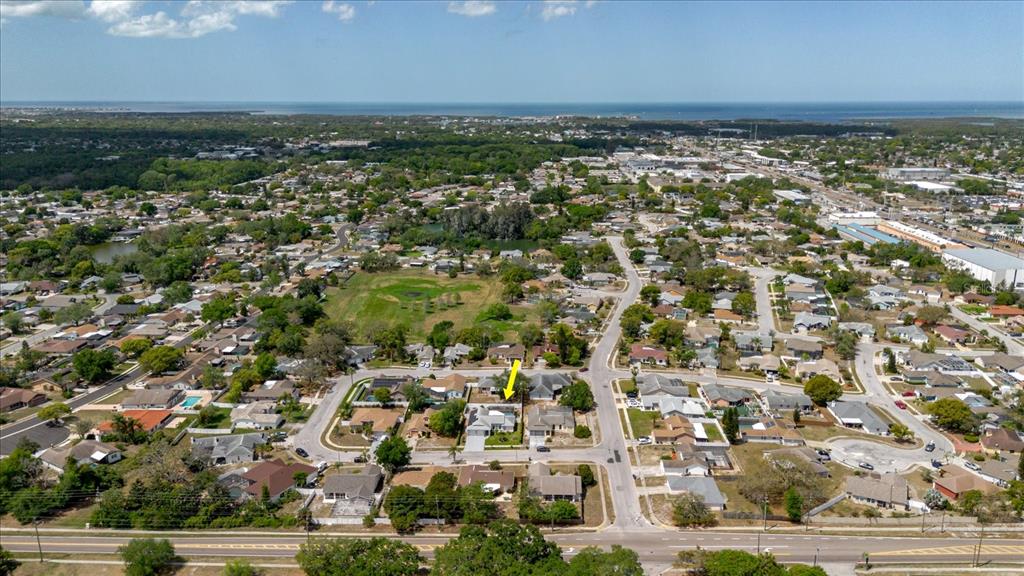 8112 Golden Bear Loop Port Richey, FL 34668 - Photo 2 of 88 an aerial view of residential houses with outdoor space and trees