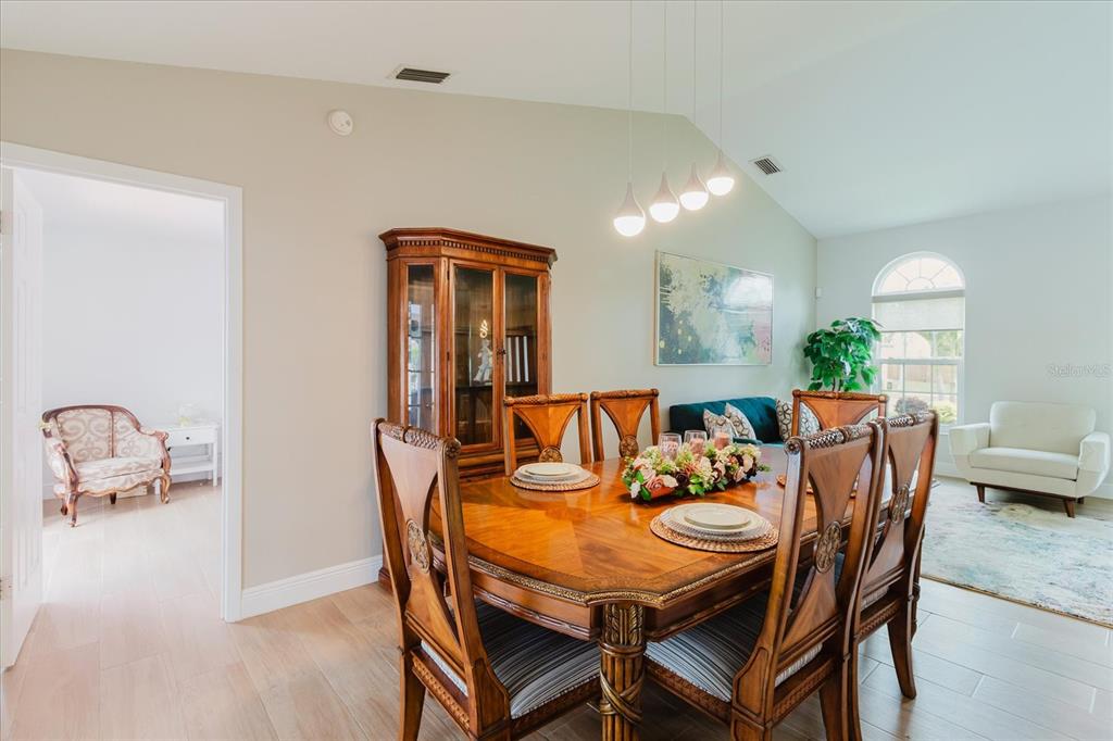 8112 Golden Bear Loop Port Richey, FL 34668 - Photo 23 of 88 a view of a dining room with furniture