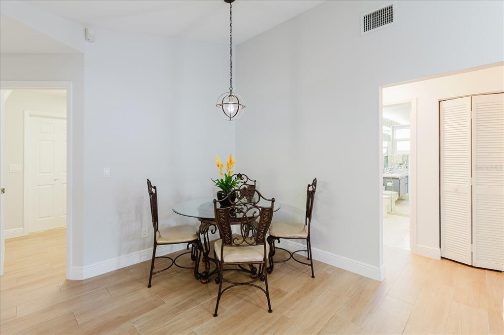 8112 Golden Bear Loop Port Richey, FL 34668 - Photo 32 of 88 a view of a dining room with furniture and wooden floor