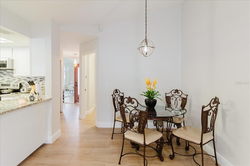8112 Golden Bear Loop Port Richey, FL 34668 - Photo 33 of 88 a view of a dining room with furniture and wooden floor