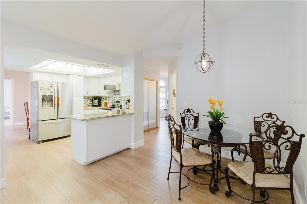 8112 Golden Bear Loop Port Richey, FL 34668 - Photo 34 of 88 a view of a dining room with furniture and a potted plant