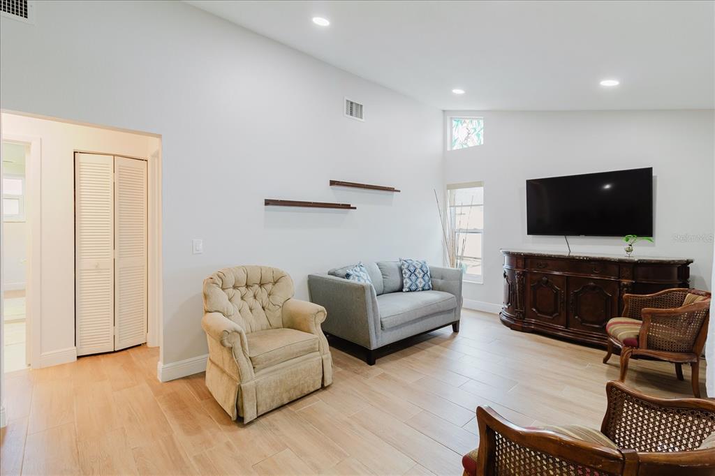 8112 Golden Bear Loop Port Richey, FL 34668 - Photo 37 of 88 a living room with furniture and a flat screen tv