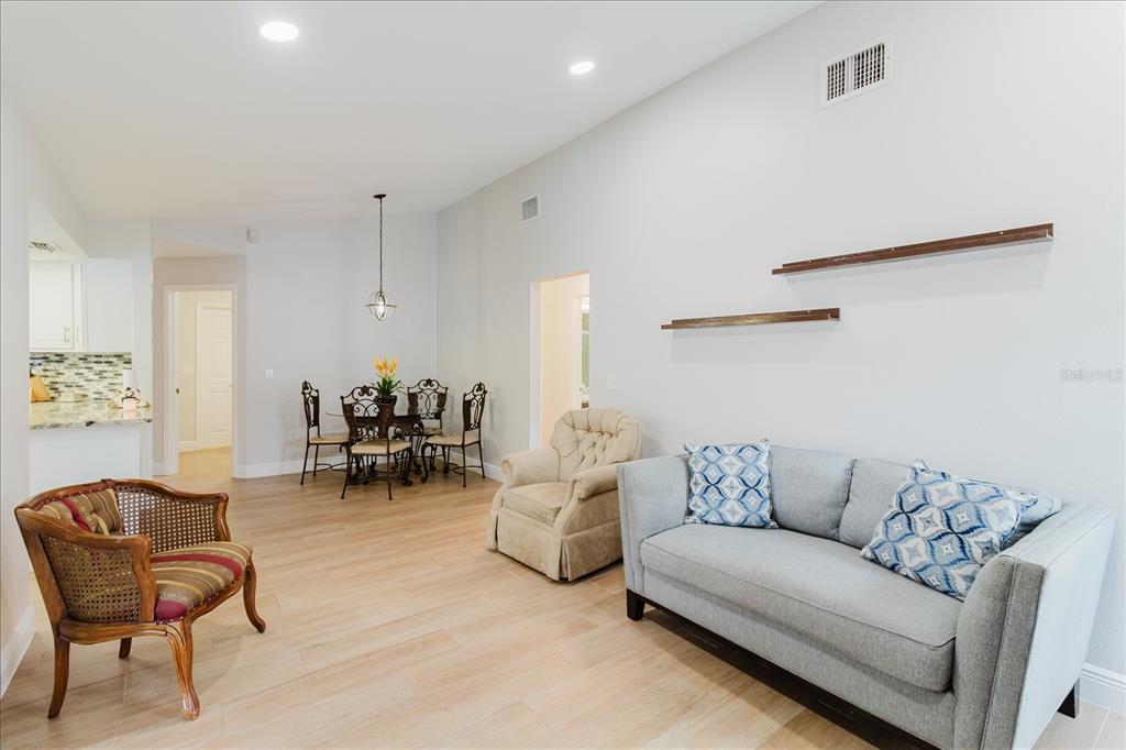 8112 Golden Bear Loop Port Richey, FL 34668 - Photo 38 of 88 a living room with furniture and a chair