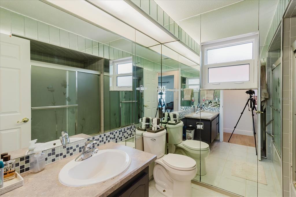 8112 Golden Bear Loop Port Richey, FL 34668 - Photo 50 of 88 a bathroom with a sink a toilet and shower