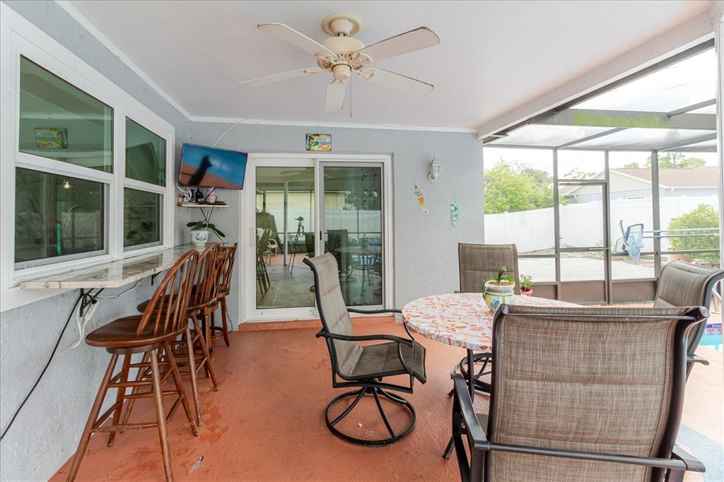 8112 Golden Bear Loop Port Richey, FL 34668 - Photo 58 of 88 a view of a dining room with furniture window and outside view