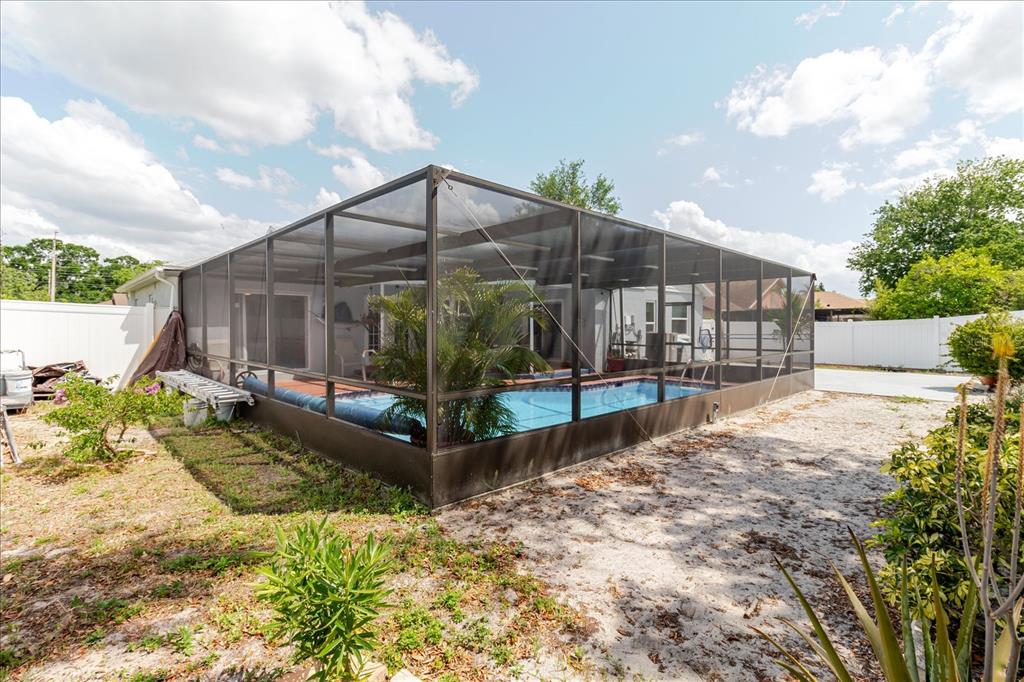 8112 Golden Bear Loop Port Richey, FL 34668 - Photo 65 of 88 a view of a small yard in front of a house