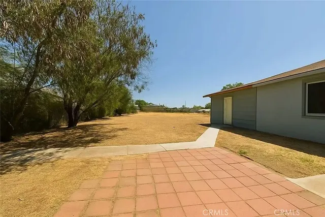 a view of a backyard of the house