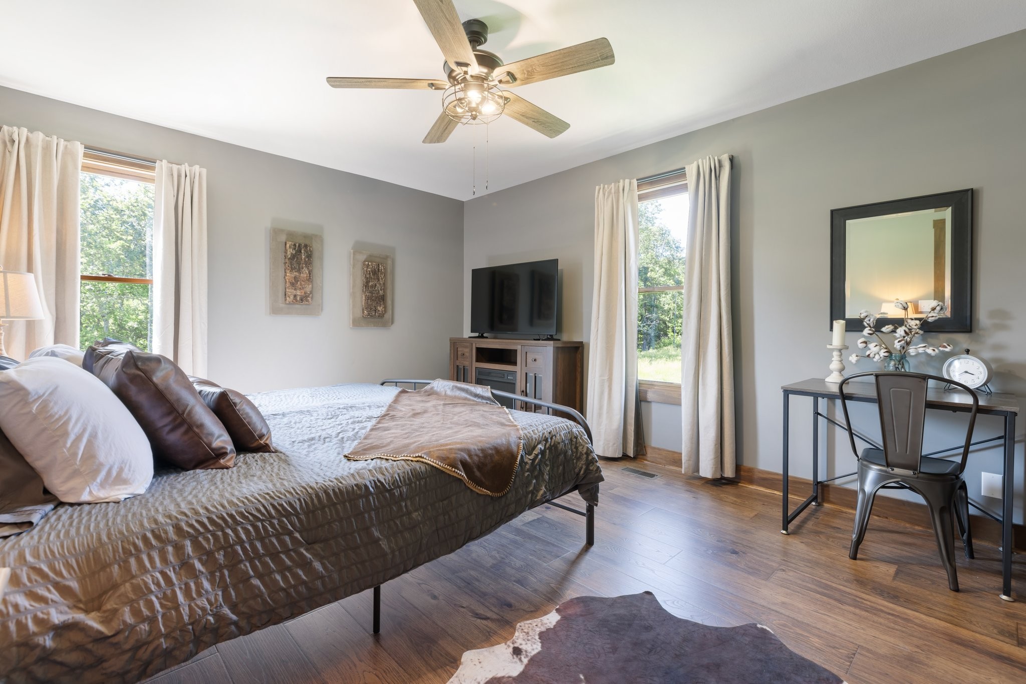 2890 Ellis Lane Palmyra, TN 37142 - Photo 12 of 19 a bedroom with a large bed a flat tv screen and a dresser