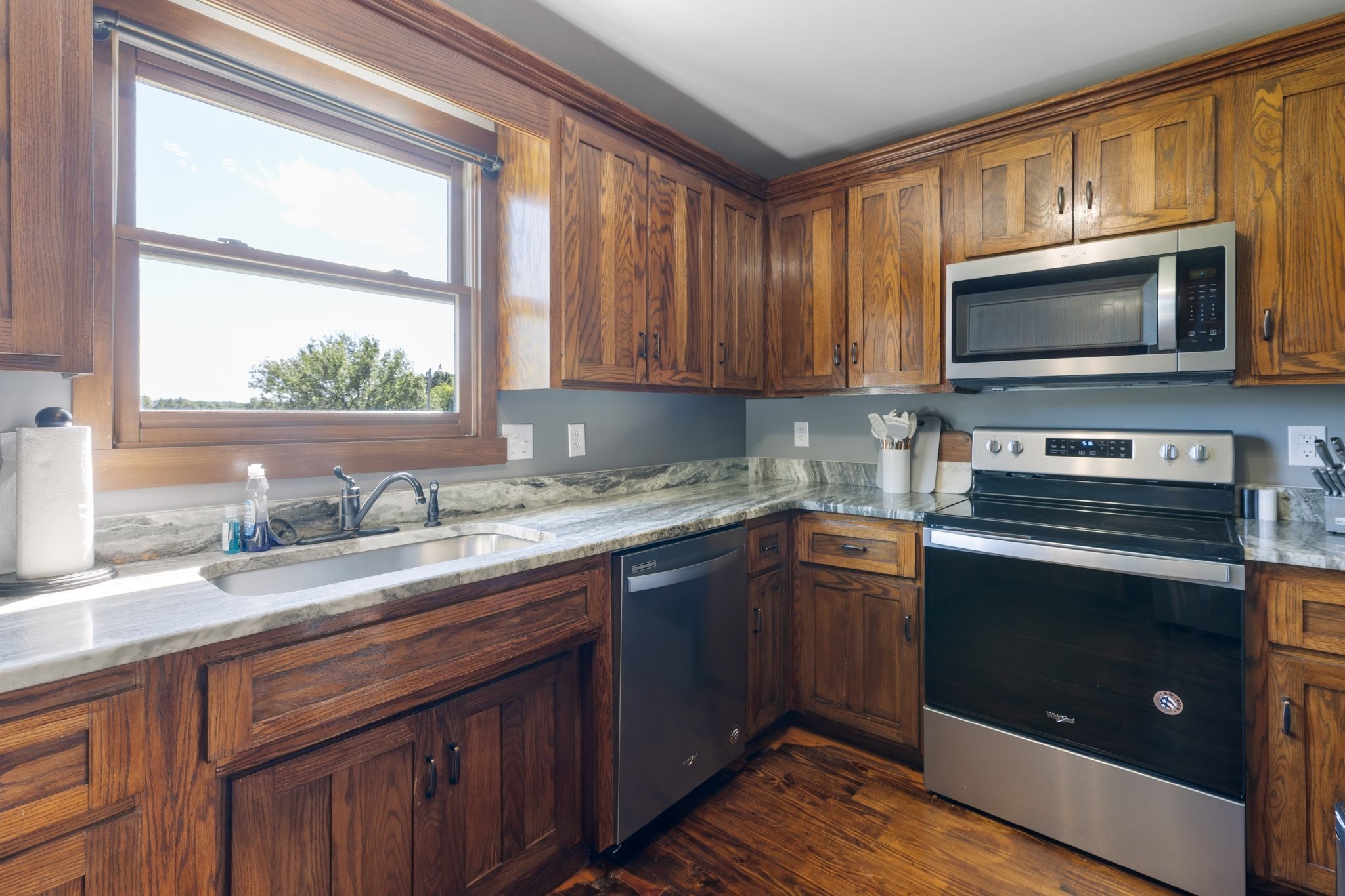 2890 Ellis Lane Palmyra, TN 37142 - Photo 10 of 19 a kitchen with granite countertop cabinets stainless steel appliances a sink and a window