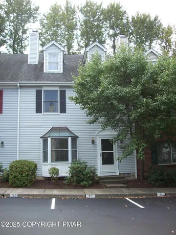 front view of a house with a street