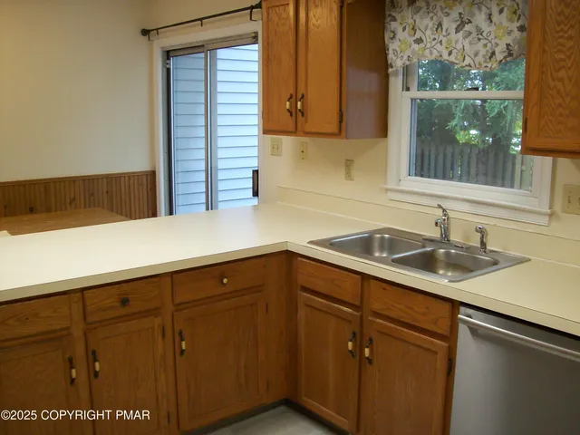a kitchen with a sink and cabinets