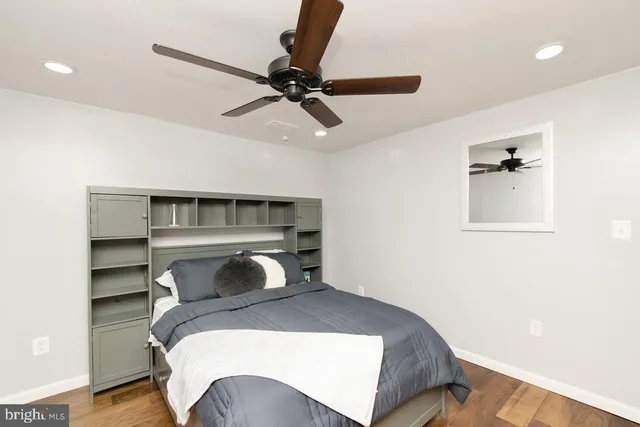 a bedroom with a bed and cabinets