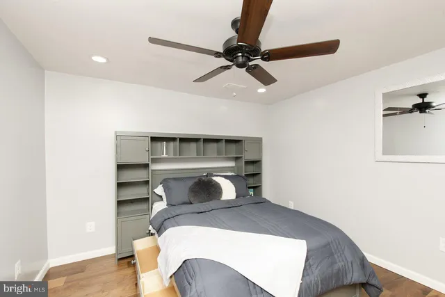 a kitchen with a refrigerator and cabinets