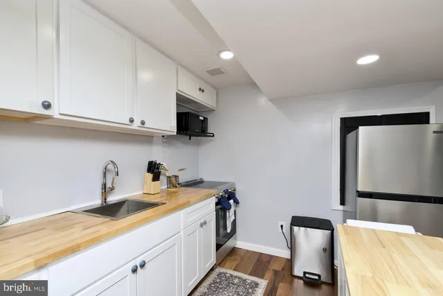 a living room with furniture and a rug