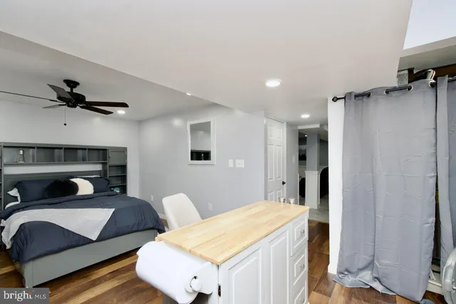a kitchen with a sink a stove and cabinets