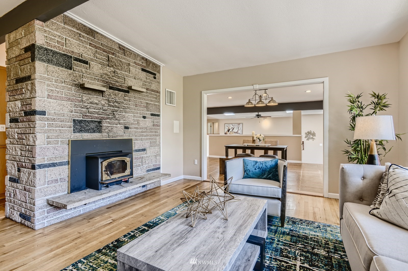 2207 242nd Street Southwest Bothell, WA 98021 - Photo 5 of 28 a living room with furniture and a fireplace