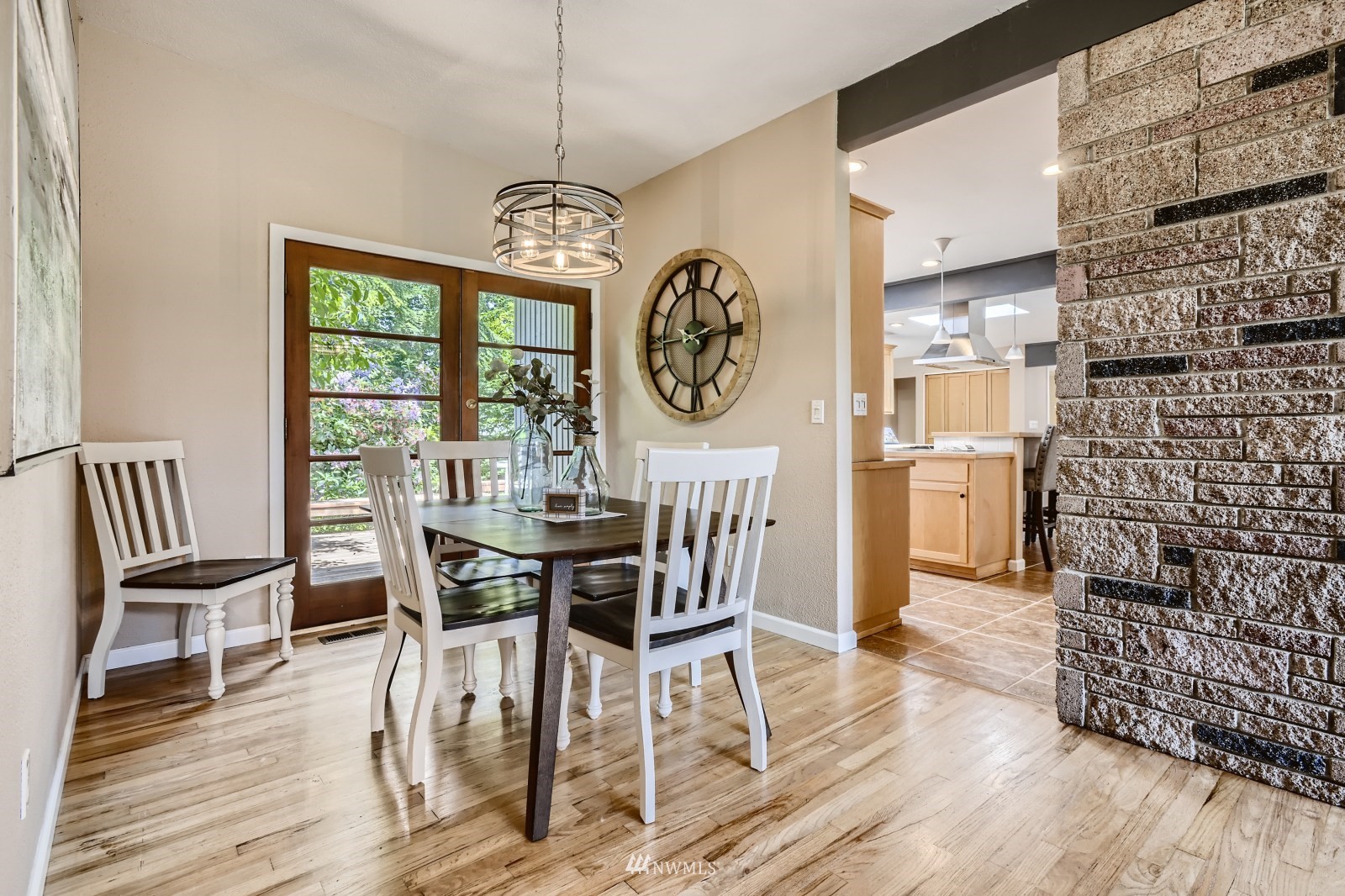2207 242nd Street Southwest Bothell, WA 98021 - Photo 6 of 28 a view of a dining room with furniture window and wooden floor