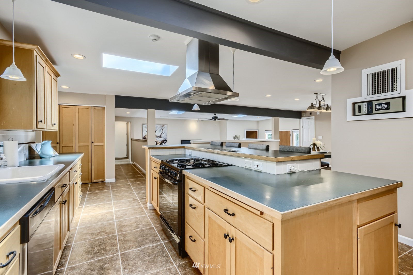 2207 242nd Street Southwest Bothell, WA 98021 - Photo 9 of 28 a kitchen with stainless steel appliances granite countertop a sink and a stove