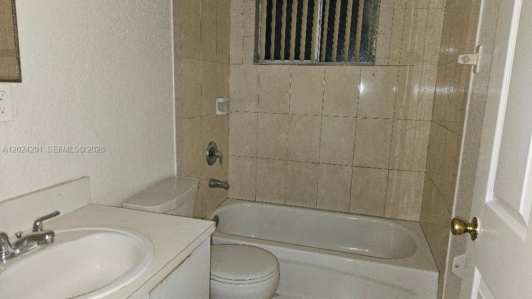 11970 Southwest 217th Street Miami, FL 33170 - Photo 9 of 10 a bathroom with a sink toilet and shower