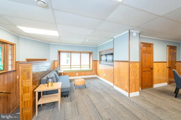 a view of a room with wooden floor