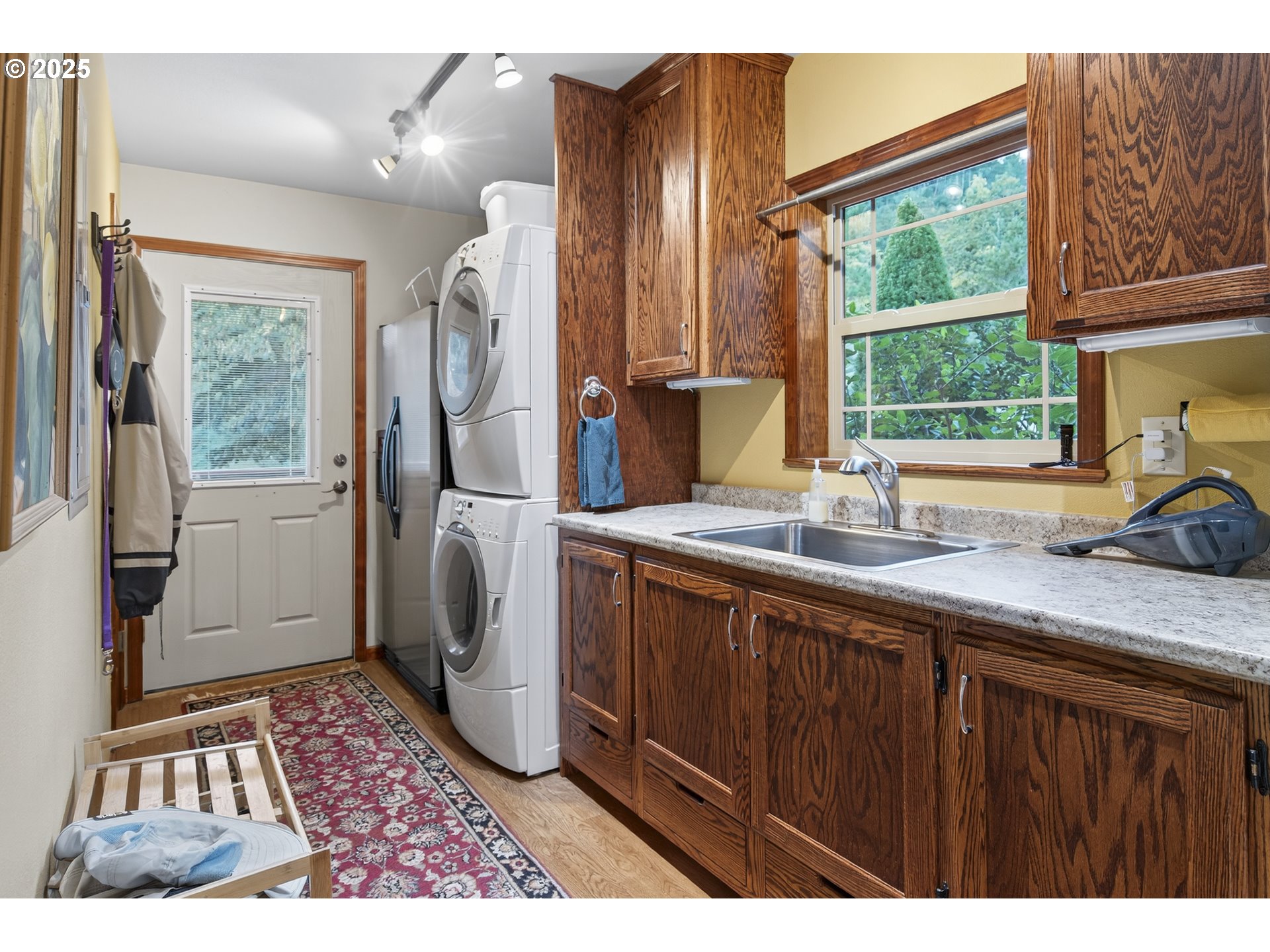 1645 Brozio Road Roseburg, OR 97471 - Photo 14 of 48 a bathroom with a sink a mirror and next to a window