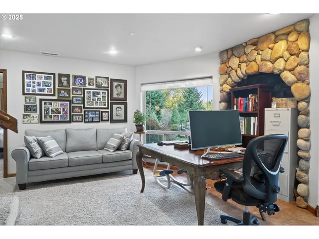 a bedroom with a bed lamp and window