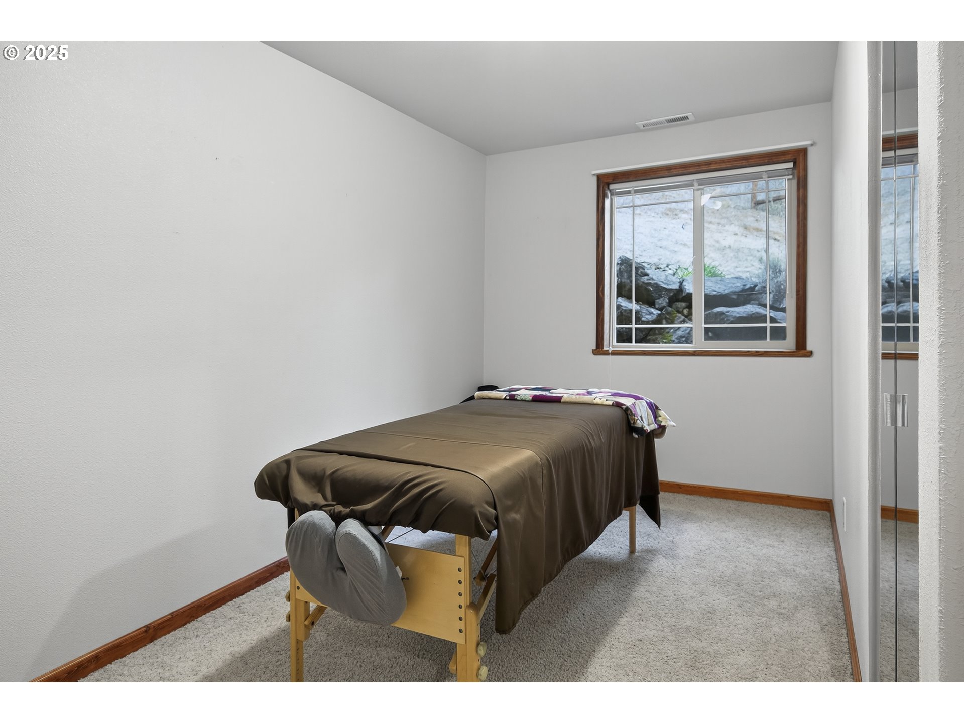 1645 Brozio Road Roseburg, OR 97471 - Photo 23 of 48 a bedroom with a bed and a window