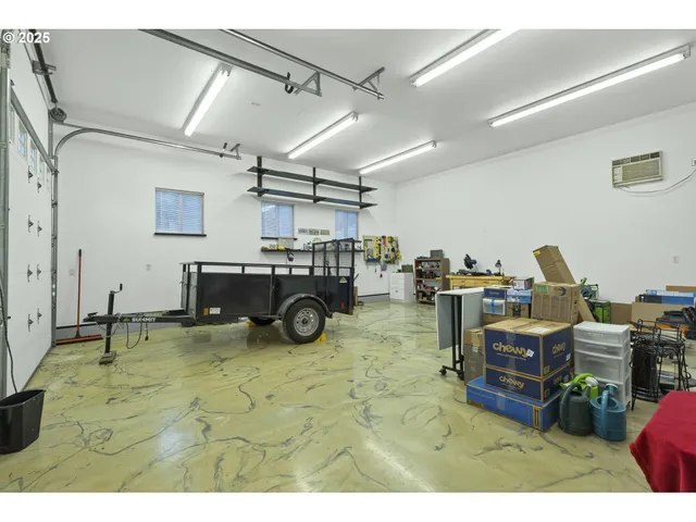 a kitchen with a sink and a stove with wooden floor