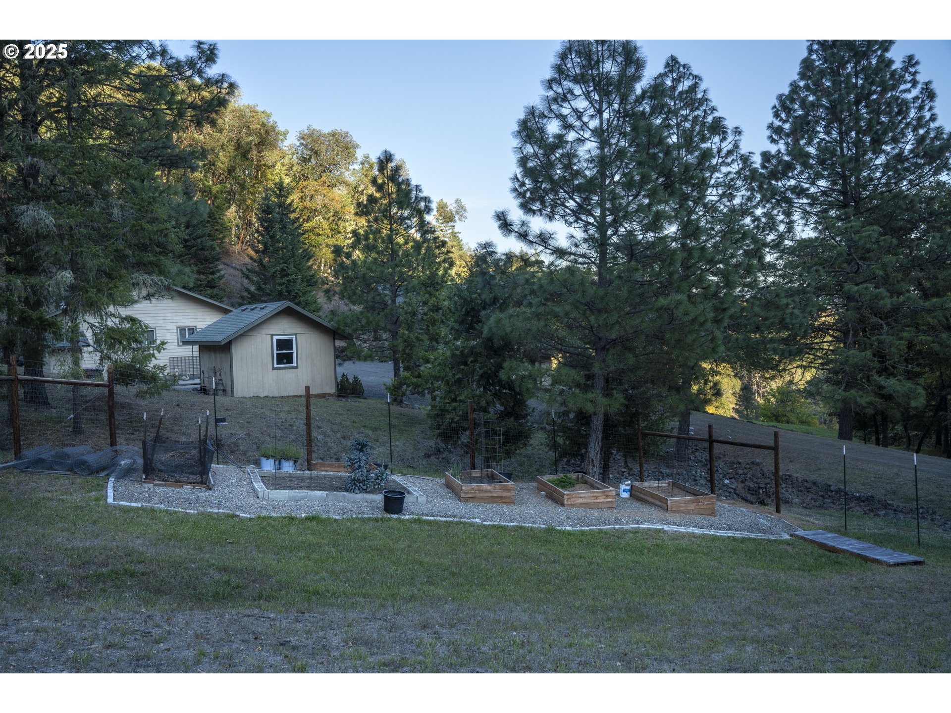 1645 Brozio Road Roseburg, OR 97471 - Photo 37 of 48 a front view of a house with a yard and trees