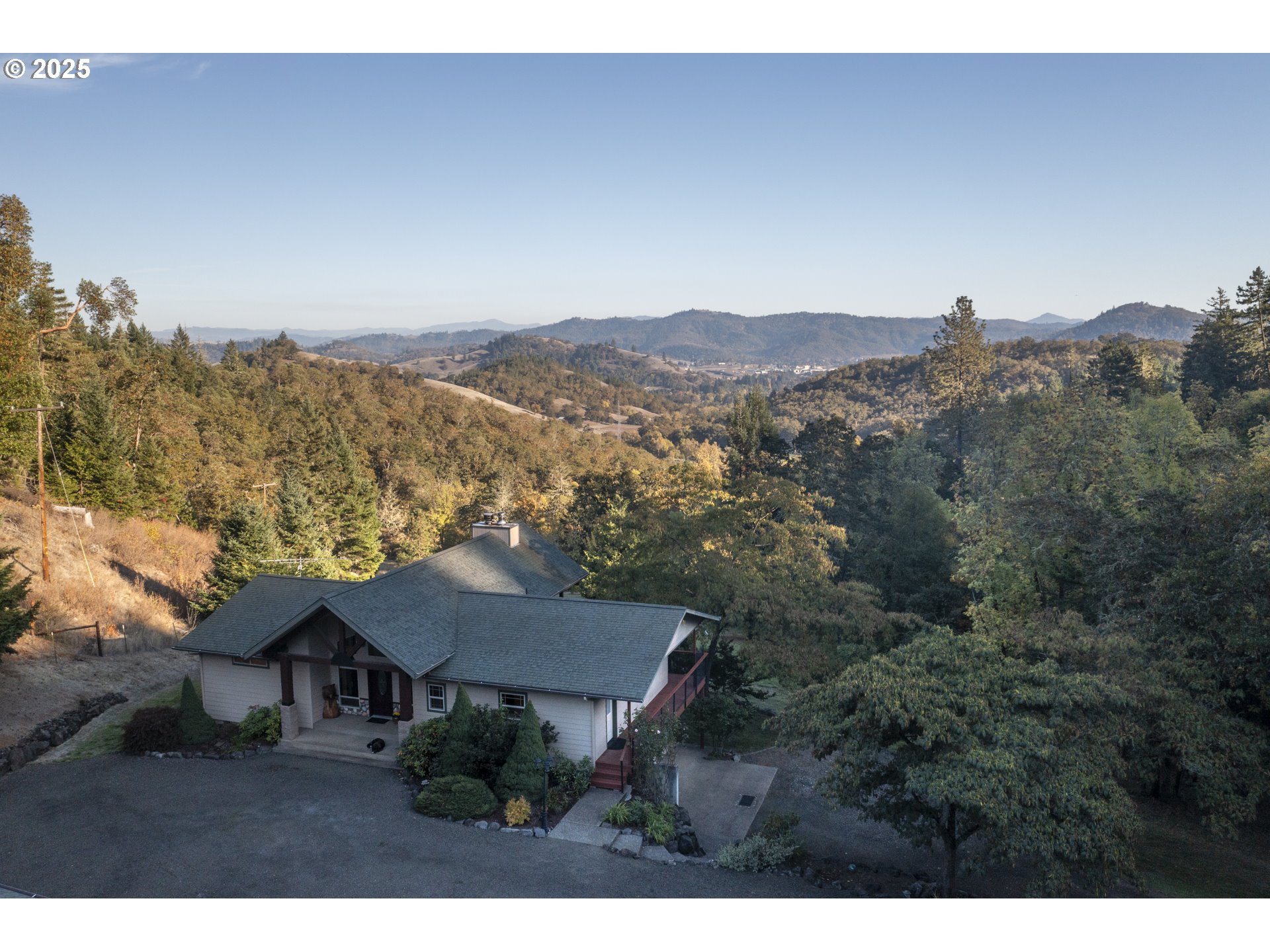1645 Brozio Road Roseburg, OR 97471 - Photo 45 of 48 a view of a house with a mountain
