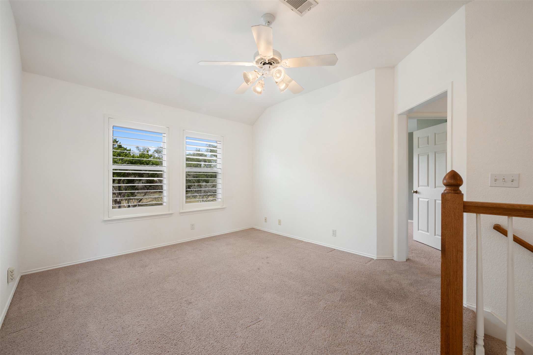 104 Sunset Road Georgetown, TX 78633 - Photo 25 of 40 Spare room with carpet flooring, ceiling fan, and vaulted ceiling