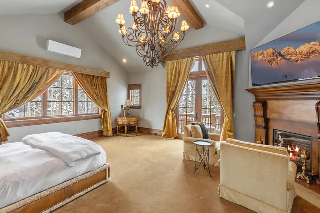 a bed room with a bed and a large window