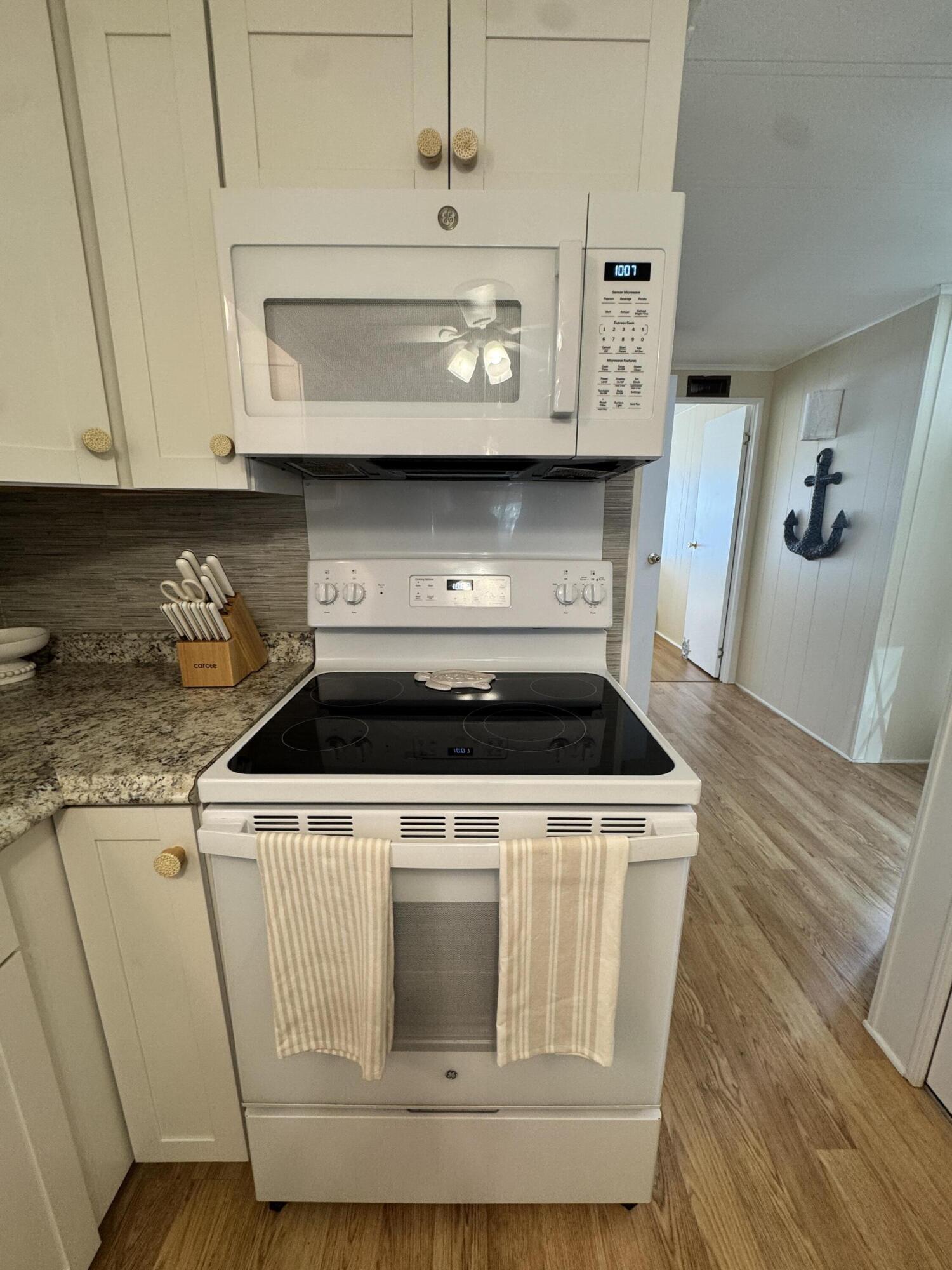 17 Verde Vista Fort Pierce, FL 34951 - Photo 12 of 35 a stove top oven sitting inside of a kitchen
