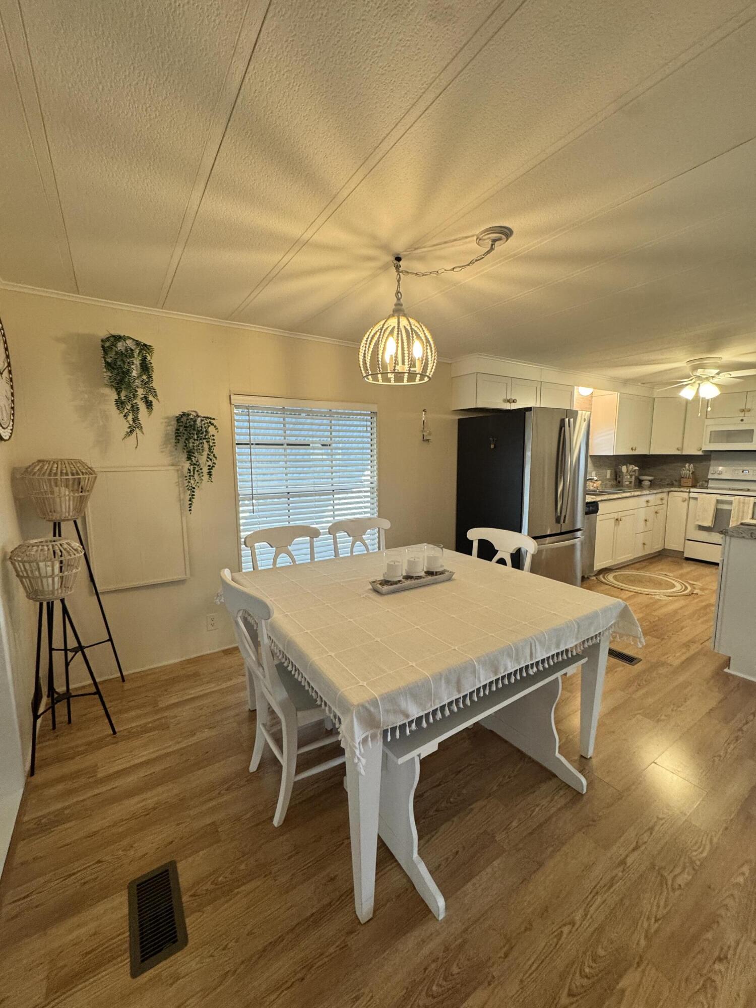 17 Verde Vista Fort Pierce, FL 34951 - Photo 14 of 35 a large kitchen with a table and chairs