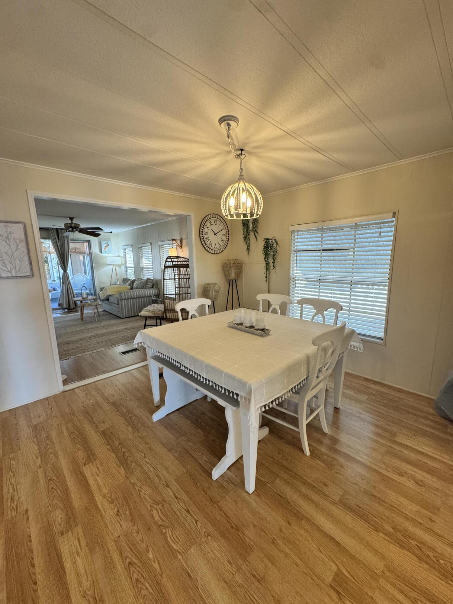 17 Verde Vista Fort Pierce, FL 34951 - Photo 15 of 35 a living room with furniture a table and wooden floor