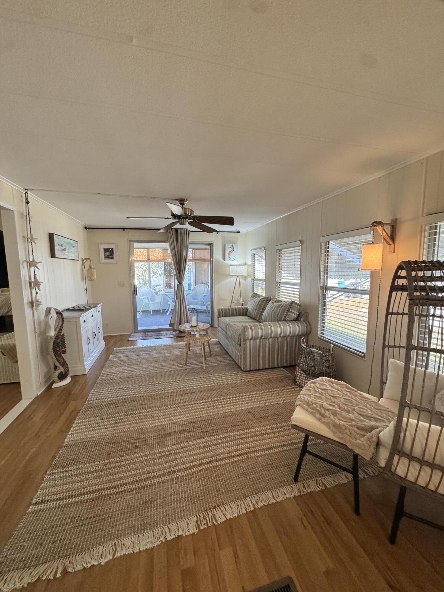 17 Verde Vista Fort Pierce, FL 34951 - Photo 20 of 35 a bedroom with furniture and a wooden floor