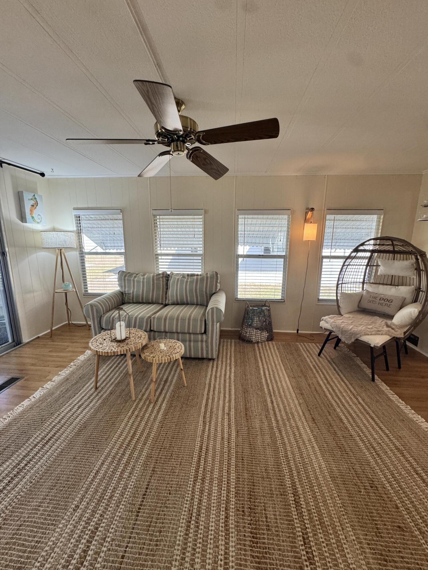 17 Verde Vista Fort Pierce, FL 34951 - Photo 22 of 35 a living room with furniture and a wooden floor