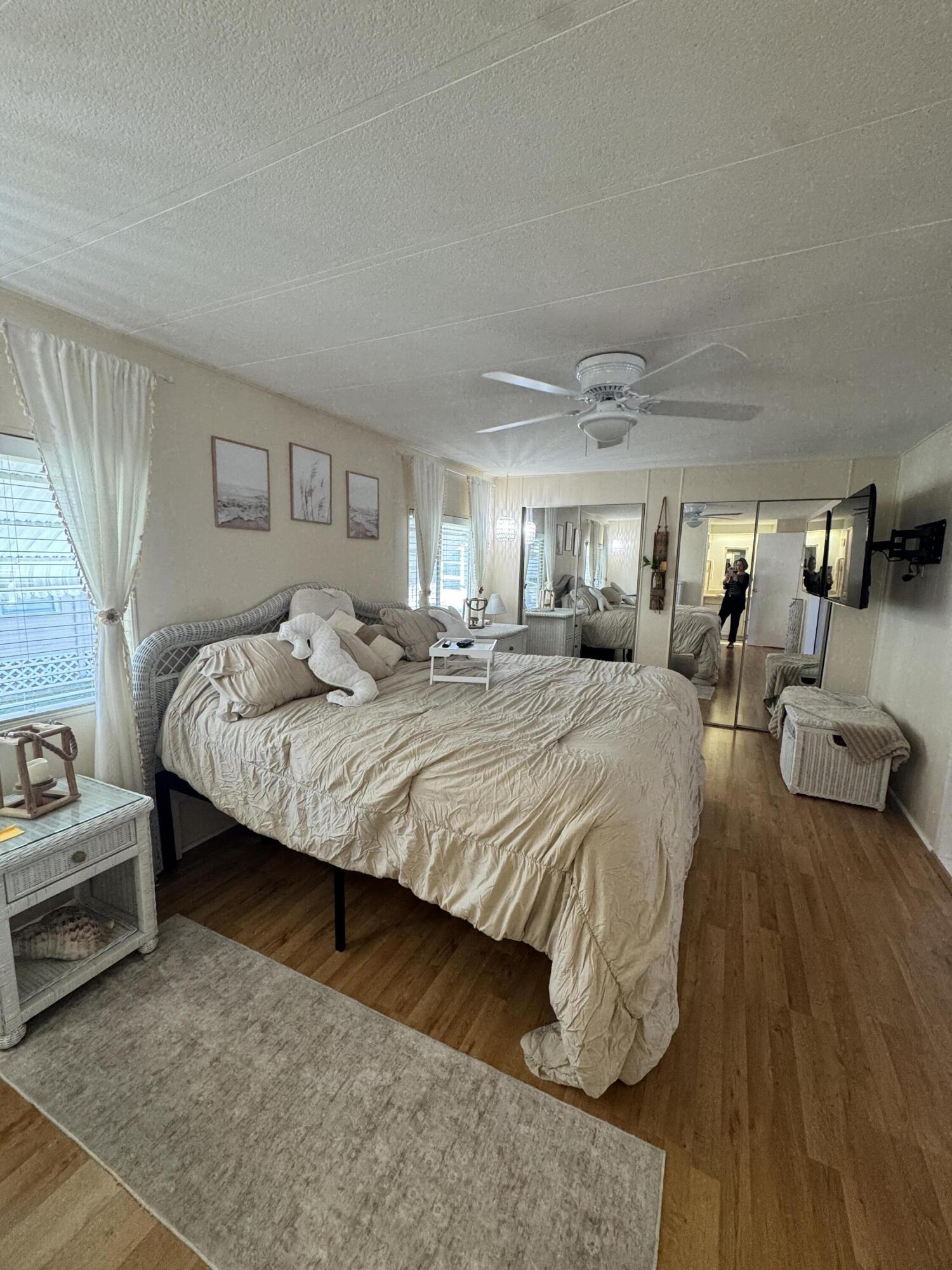 17 Verde Vista Fort Pierce, FL 34951 - Photo 24 of 35 a bedroom with a bed a couch and dresser