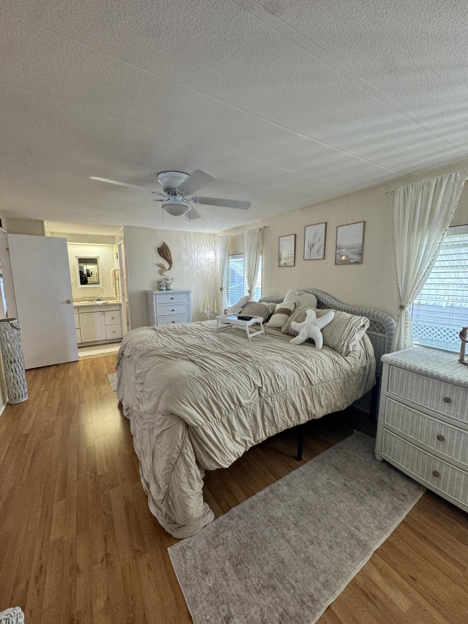 17 Verde Vista Fort Pierce, FL 34951 - Photo 25 of 35 a bedroom with a bed and a dresser