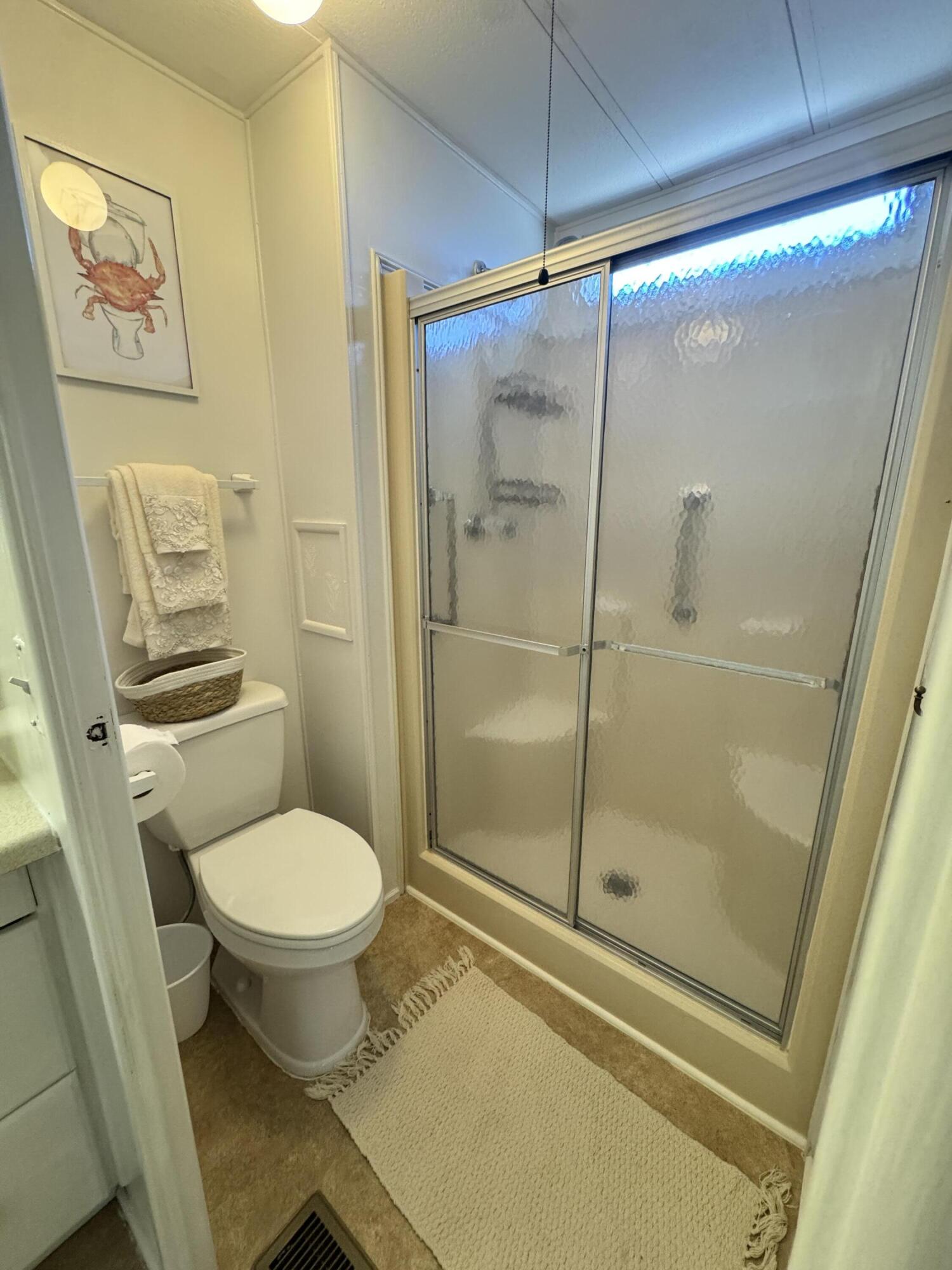 17 Verde Vista Fort Pierce, FL 34951 - Photo 27 of 35 a bathroom with a shower and toilet