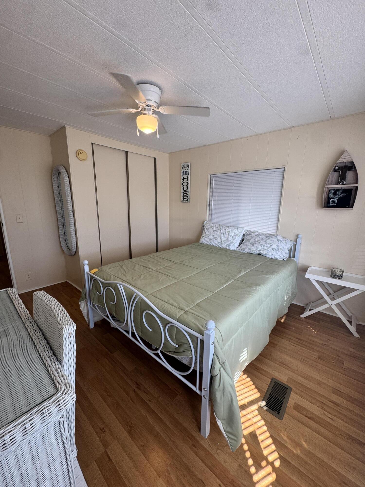 17 Verde Vista Fort Pierce, FL 34951 - Photo 28 of 35 a bedroom with a bed and a dresser