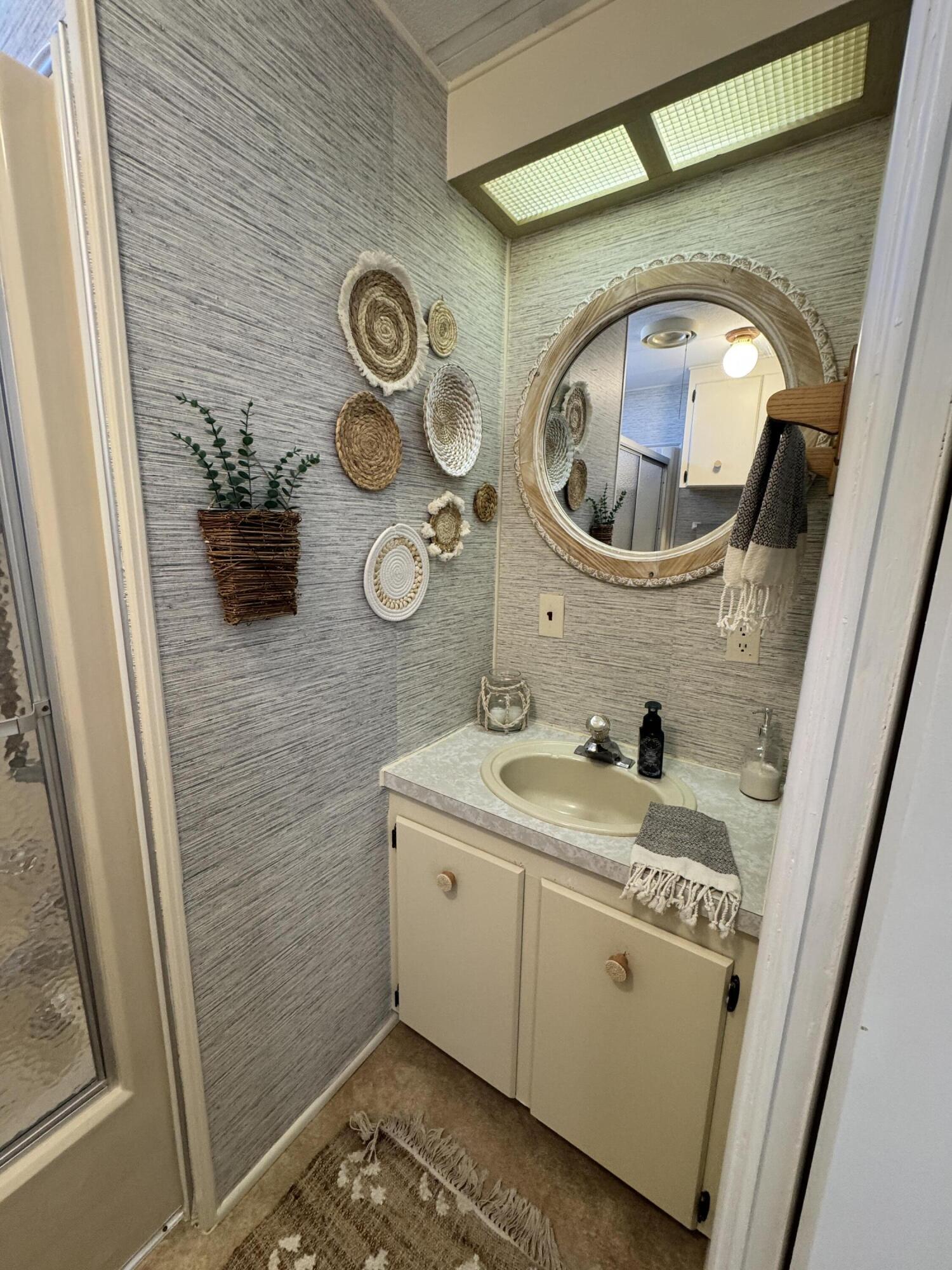 17 Verde Vista Fort Pierce, FL 34951 - Photo 30 of 35 a bathroom with a toilet and a sink